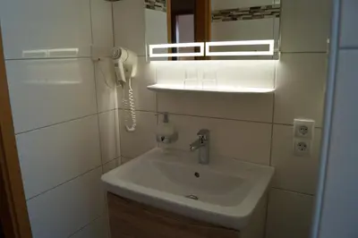 Ein Badezimmer in der Unterkunft Hotel Neuses