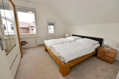 Ein Bett oder Betten in einem Zimmer der Unterkunft Haus 4Muscheln Appartement 4M2