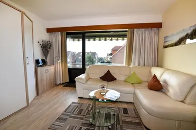Ein Sitzbereich in der Unterkunft Haus Jan am Strand Wohnung - 215