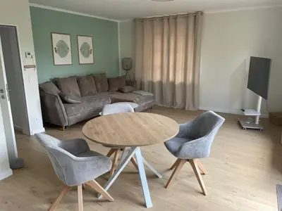 Ein Sitzbereich in der Unterkunft Ferienanlage Wattenwind Fewo 27 1 NordseeNest