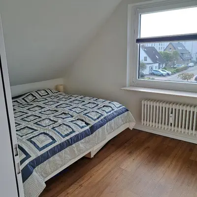 Ein Bett oder Betten in einem Zimmer der Unterkunft Ferienwohnung Fischerbude