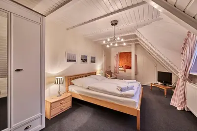 Ein Bett oder Betten in einem Zimmer der Unterkunft Dünengras
