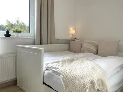 Ein Bett oder Betten in einem Zimmer der Unterkunft Haus am Waldbad FeWo 21