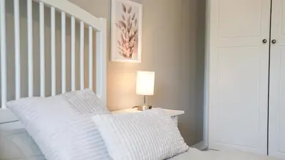 Ein Bett oder Betten in einem Zimmer der Unterkunft gemütliches Ferienhaus hinterm Deich
