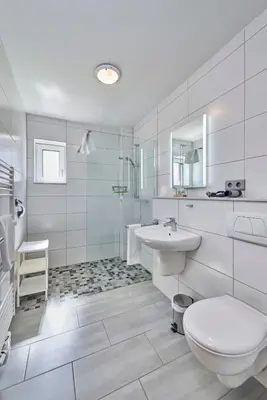 Ein Badezimmer in der Unterkunft Haus Maike 13A