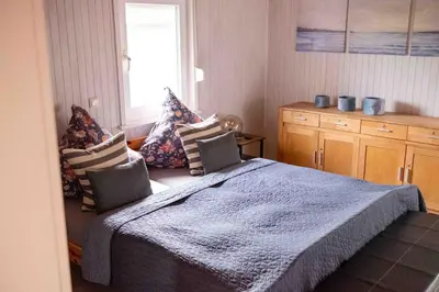 Ein Bett oder Betten in einem Zimmer der Unterkunft Suedseeurlaub2 - Ferienhaus in Otterndorf