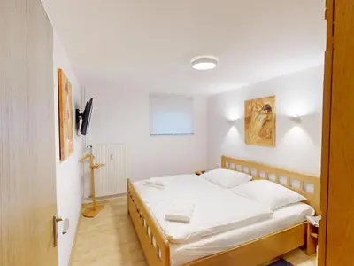 Ein Bett oder Betten in einem Zimmer der Unterkunft Knechtsand - 403