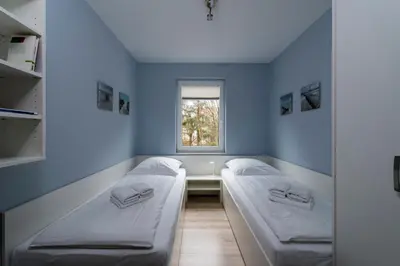 Ein Bett oder Betten in einem Zimmer der Unterkunft Leuchtfeuer - 8