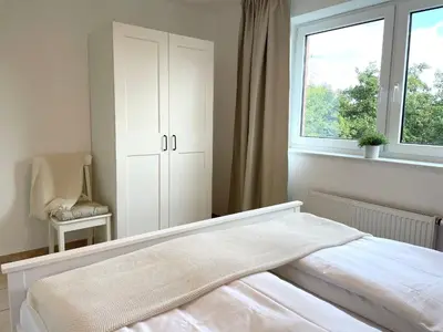 Ein Bett oder Betten in einem Zimmer der Unterkunft Haus am Waldbad FeWo 21