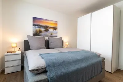 Ein Bett oder Betten in einem Zimmer der Unterkunft Dorumer Sielhuus 5