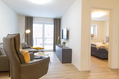 Ein Bett oder Betten in einem Zimmer der Unterkunft Dorumer Sielhuss 11
