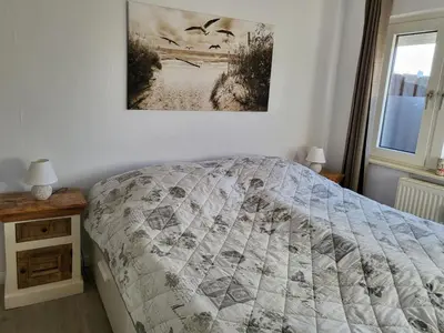 Ein Bett oder Betten in einem Zimmer der Unterkunft Küstenrose
