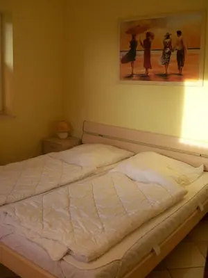Ein Bett oder Betten in einem Zimmer der Unterkunft Ferienhaus Deichblick