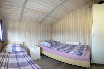 Ein Bett oder Betten in einem Zimmer der Unterkunft Ferienhaus Stüven