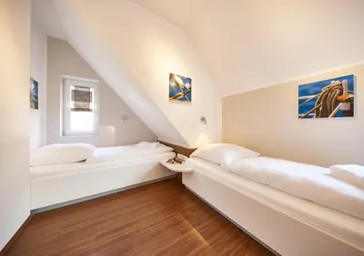 Ein Bett oder Betten in einem Zimmer der Unterkunft Residenz Seegras - 2