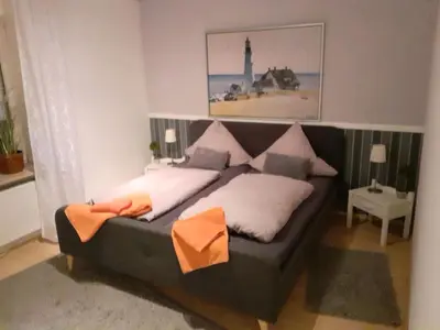 Ein Bett oder Betten in einem Zimmer der Unterkunft schöne Ferienwohnung in Friedrichskoog-Spitze
