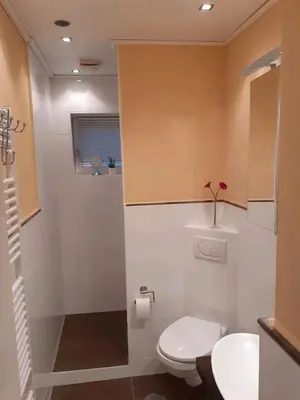 Ein Badezimmer in der Unterkunft schöne Ferienwohnung in Friedrichskoog-Spitze