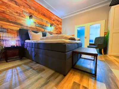 Ein Bett oder Betten in einem Zimmer der Unterkunft Villa Mila EG - by Mila FerienARPartments - Büsum Hafen, eigener Parkplatz, Terrasse