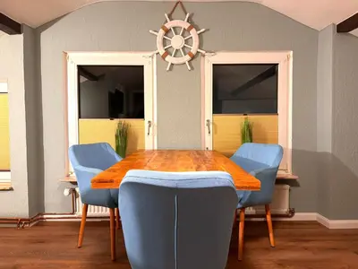 Ein Sitzbereich in der Unterkunft Villa Mila OG - by Mila FerienARPartments - Büsum Hafen, mit Sauna und eigenem Parkplatz