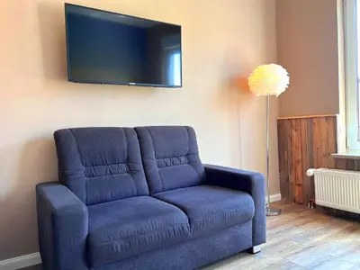 Ein Sitzbereich in der Unterkunft Villa Mila OG - by Mila FerienARPartments - Büsum Hafen, mit Sauna und eigenem Parkplatz