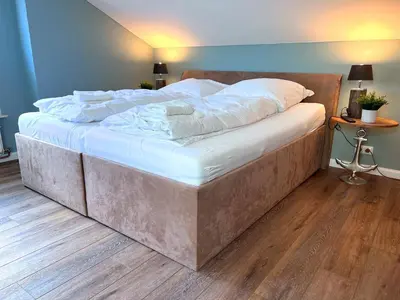 Ein Bett oder Betten in einem Zimmer der Unterkunft Villa Mila OG - by Mila FerienARPartments - Büsum Hafen, mit Sauna und eigenem Parkplatz