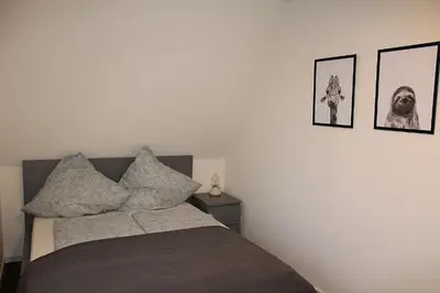 Ein Bett oder Betten in einem Zimmer der Unterkunft Ferienhaus Strandnah - Wohnung 2