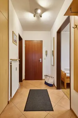 Ein Bett oder Betten in einem Zimmer der Unterkunft Rotesand - 117