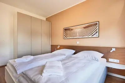 Ein Bett oder Betten in einem Zimmer der Unterkunft Residenz Seegras - 4