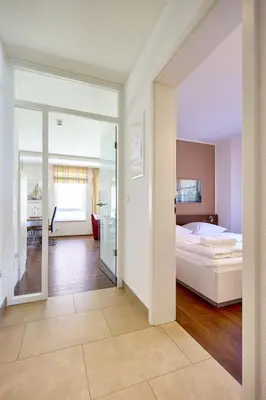 Ein Bett oder Betten in einem Zimmer der Unterkunft Residenz Seegras - 4