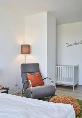 Ein Bett oder Betten in einem Zimmer der Unterkunft Rotesand - 128