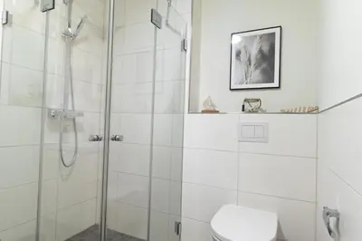 Ein Badezimmer in der Unterkunft Ferienwohnung Hyggelig - Dorumer Sielhuus 15