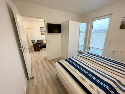 Ein Bett oder Betten in einem Zimmer der Unterkunft Residenz Mühlentrift Wohnung 11