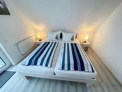 Ein Bett oder Betten in einem Zimmer der Unterkunft Residenz Mühlentrift Wohnung 11