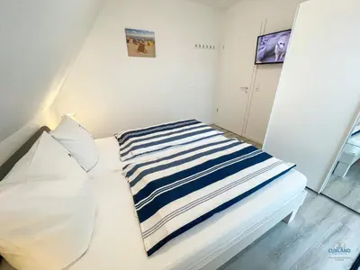 Ein Bett oder Betten in einem Zimmer der Unterkunft Residenz Mühlentrift Wohnung 11