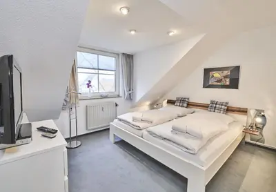 Ein Bett oder Betten in einem Zimmer der Unterkunft Scharhörn - 7
