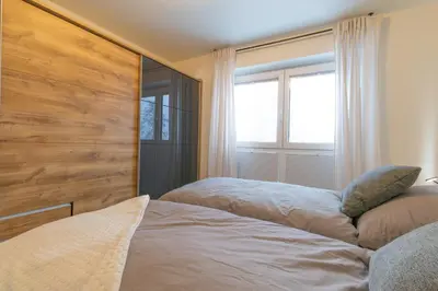 Ein Bett oder Betten in einem Zimmer der Unterkunft Ferienwohnung Seebrise - Dorumer Sielhuus 9