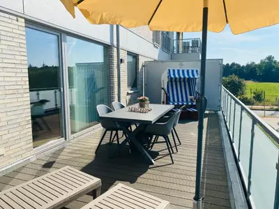 Ein Balkon oder eine Terrasse in der Unterkunft Quartier Hohe Geest 3 - strandnah mit Sauna