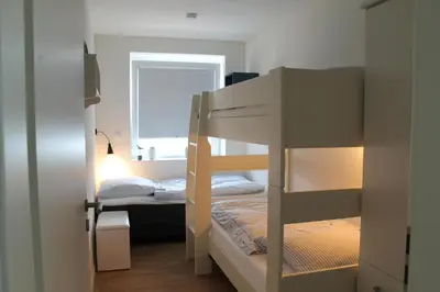 Ein Bett oder Betten in einem Zimmer der Unterkunft Quartier Hohe Geest 3 - strandnah mit Sauna