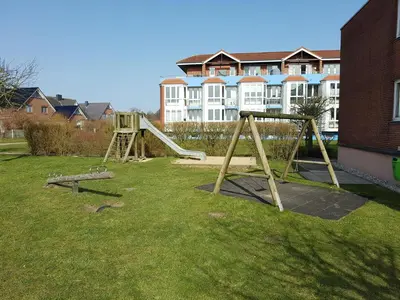 Ein Kinderspielbereich in der Unterkunft Watt & Wind - Pool, Sauna, Dampfbad, Tischtennis, schnelles WLAN
