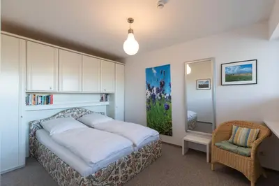 Ein Bett oder Betten in einem Zimmer der Unterkunft Terrassenhaus, Whg 48
