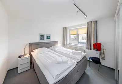Ein Bett oder Betten in einem Zimmer der Unterkunft Seeterrassen - 12