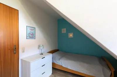 Ein Bett oder Betten in einem Zimmer der Unterkunft Haus Am Häfchenweg, Wohnung 5