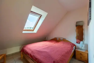 Ein Bett oder Betten in einem Zimmer der Unterkunft Haus Am Häfchenweg, Wohnung 6