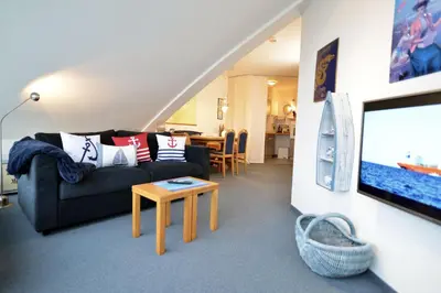 Ein Sitzbereich in der Unterkunft Haus Nordseebrandung NC74