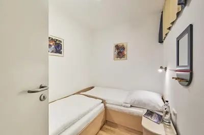 Ein Bett oder Betten in einem Zimmer der Unterkunft Strandpalais - C3