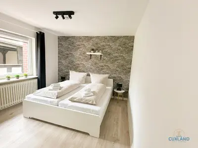 Ein Bett oder Betten in einem Zimmer der Unterkunft Auszeit am Grünstrand