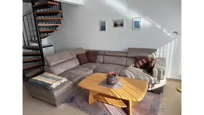 Ein Sitzbereich in der Unterkunft Ferienhaus To Huus