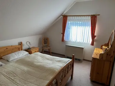 Ein Bett oder Betten in einem Zimmer der Unterkunft Ferienhaus To Huus
