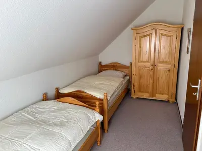 Ein Bett oder Betten in einem Zimmer der Unterkunft Ferienhaus To Huus