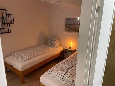 Ein Bett oder Betten in einem Zimmer der Unterkunft Haus Baltic Koje 04